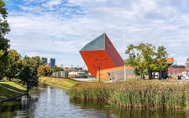 Gdansk World War II Museum along a canal on the Highlight Bike Tour.