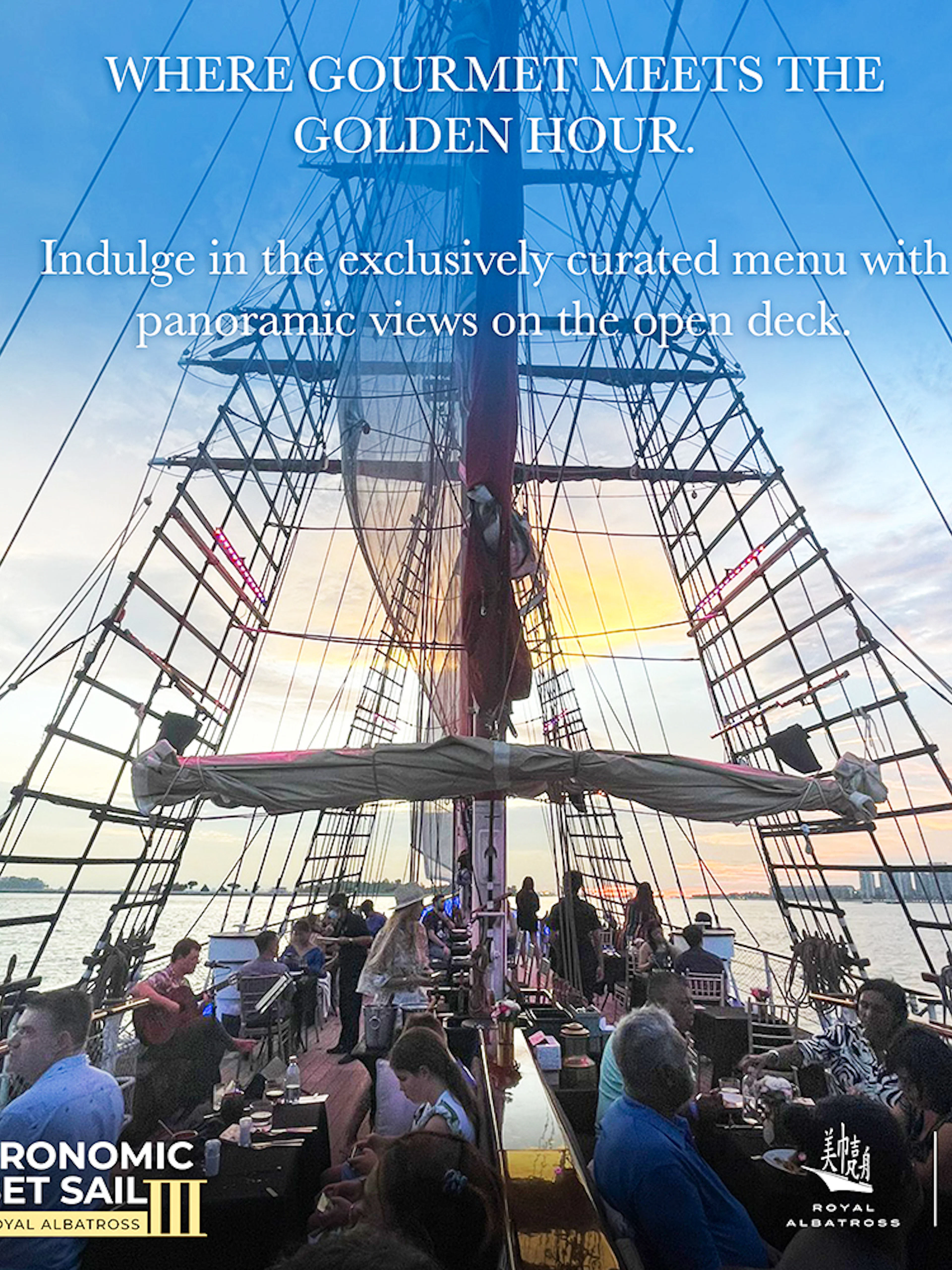 Dinner cruise on The Royal Albatross with guests dining on deck at sunset.