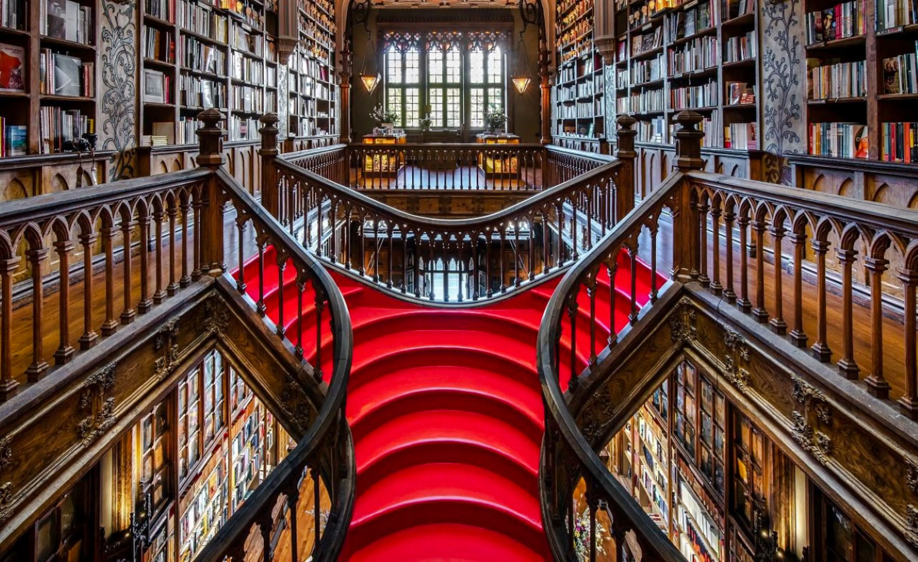 Livraria Lello's ornate staircase and bookshelves, Porto.
