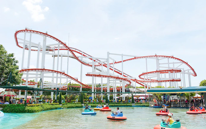 Roller coaster and bumper boats at Dream World Bangkok.