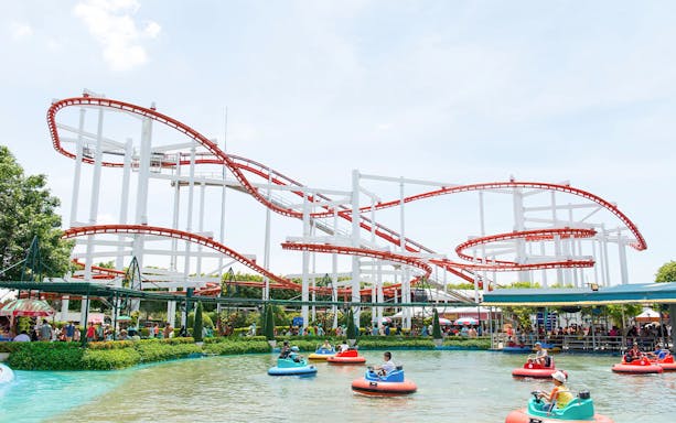 Roller coaster and bumper boats at Dream World Bangkok.