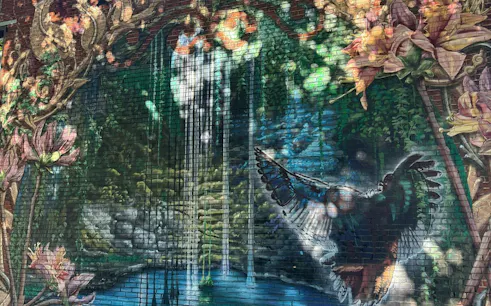 Mural of a bird and waterfall in Montreal's Little Burgundy district.