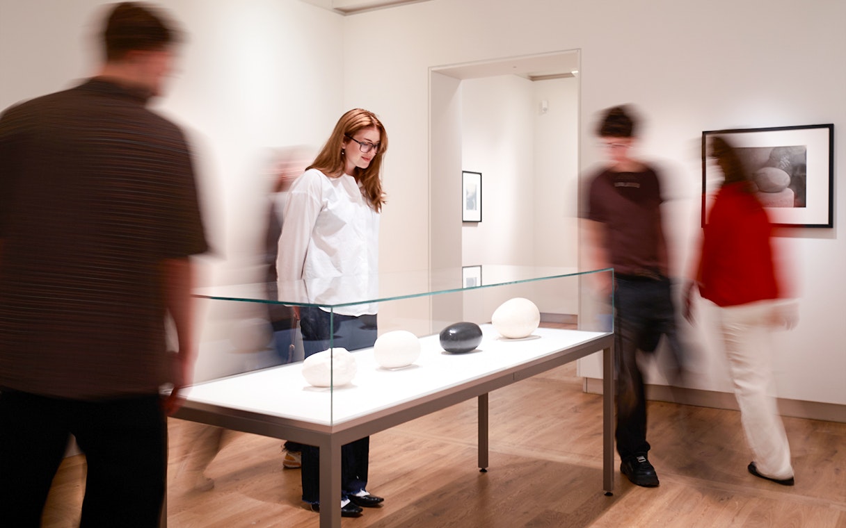 Guests viewing sculptures at H’ART Museum exhibit.