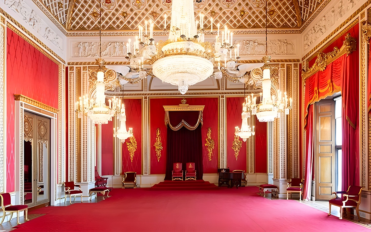 Buckingham Palace State Room with chandeliers and red decor.