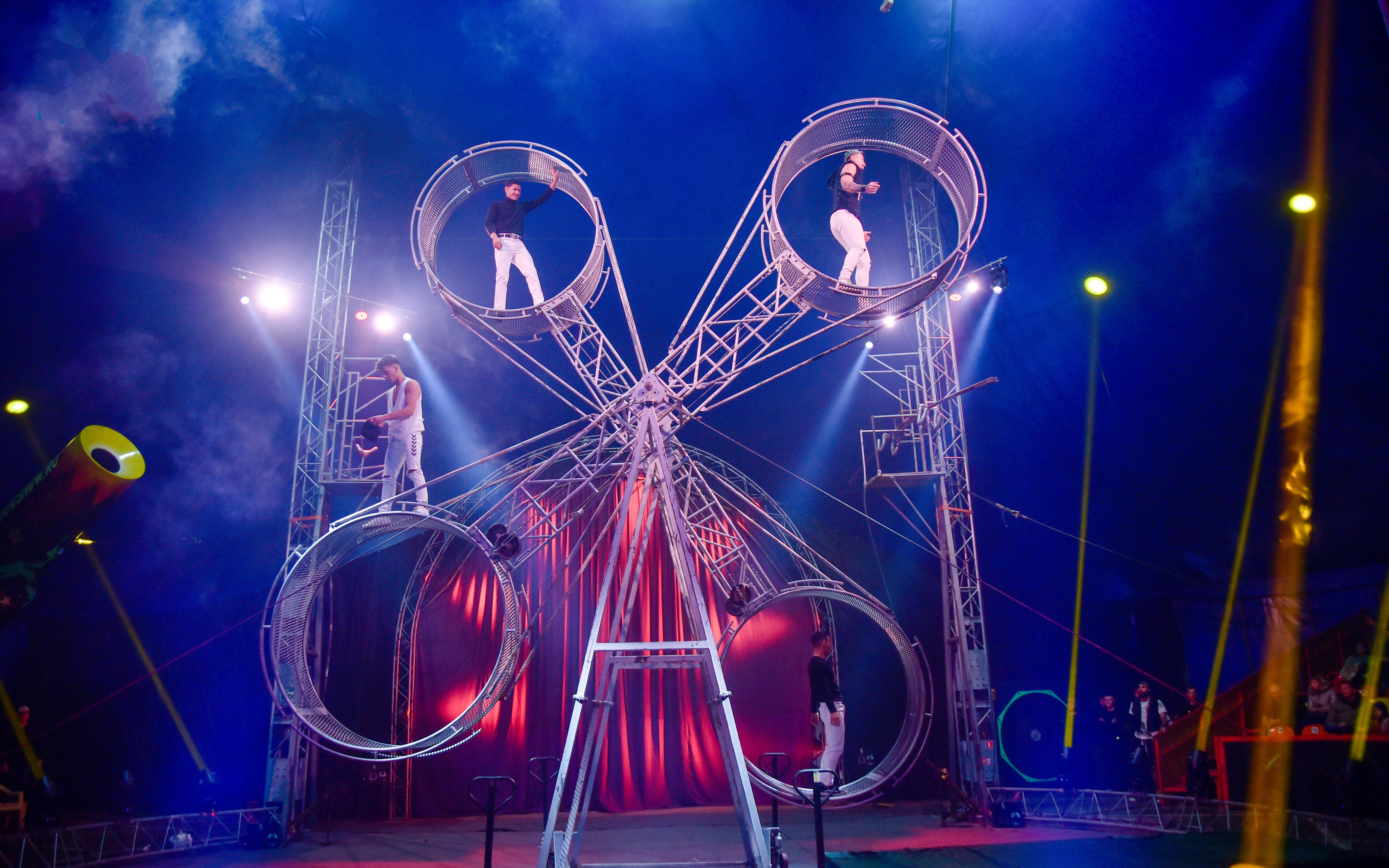 Performers on rotating wheels at Aqua Circus Phuket.