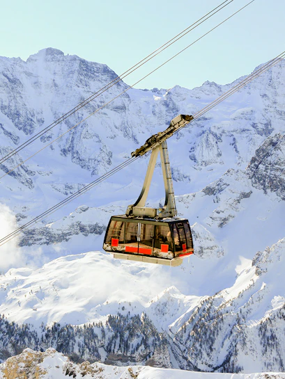 Cable car ascending to the Schilthorn summit in the Swiss Alps.