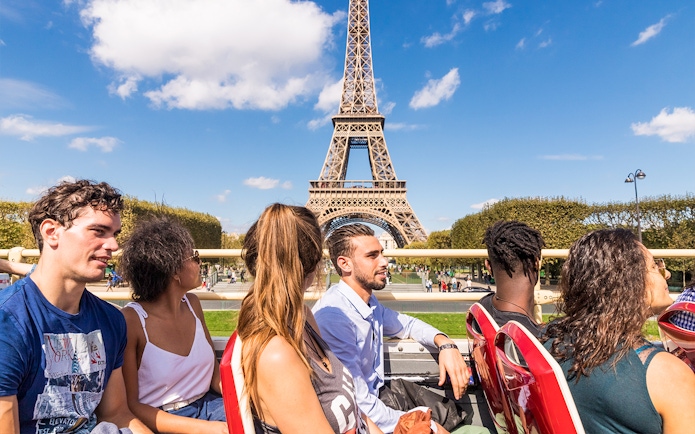 Tourists on a Big Bus tour near the Eiffel Tower in Paris.