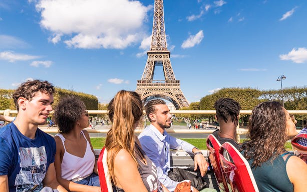 Tourists on a Big Bus tour near the Eiffel Tower in Paris.