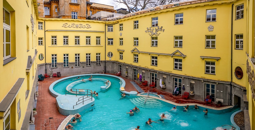 Visitors enjoying the outdoor pool at Lukács Thermal Bath, Budapest.