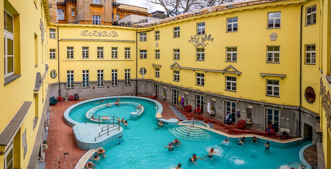 Visitors enjoying the outdoor pool at Lukács Thermal Bath, Budapest.