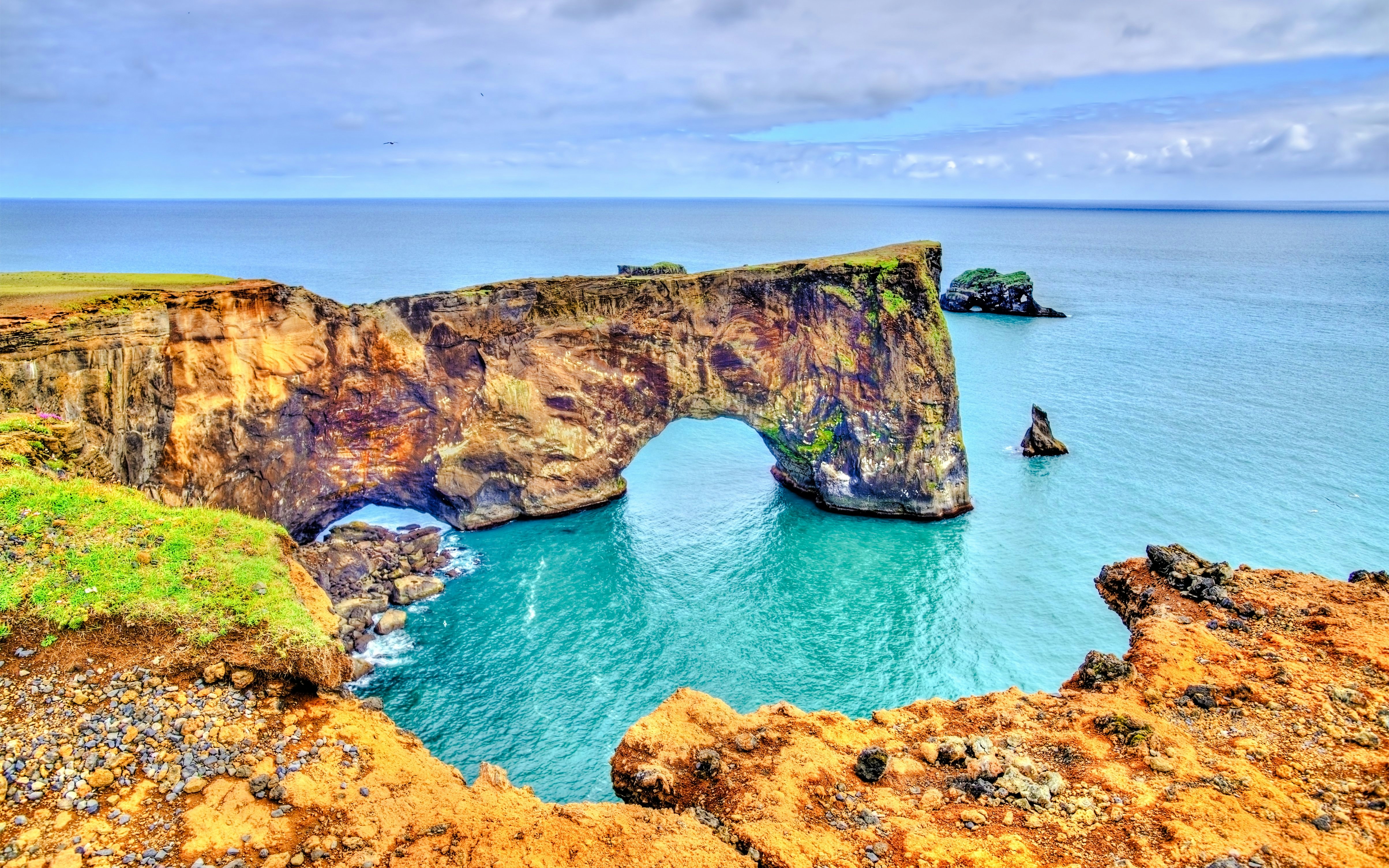 Dyrhólaey Peninsula sea arch with ocean view, Iceland.