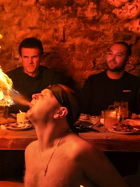 Fire breather performing at a medieval dinner show in Prague.