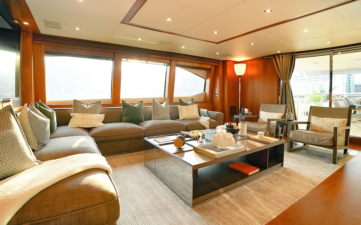 Luxurious Sunseeker superyacht interior with plush seating and elegant decor.