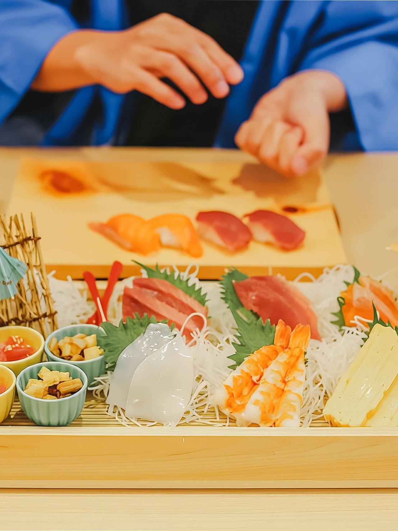 Tourist preparing sushi near Tokyo Tower with assorted ingredients on a tray.