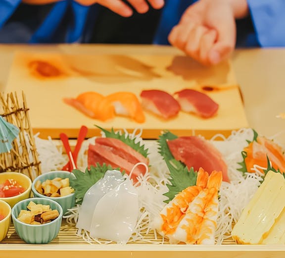 Tourist preparing sushi near Tokyo Tower with assorted ingredients on a tray.