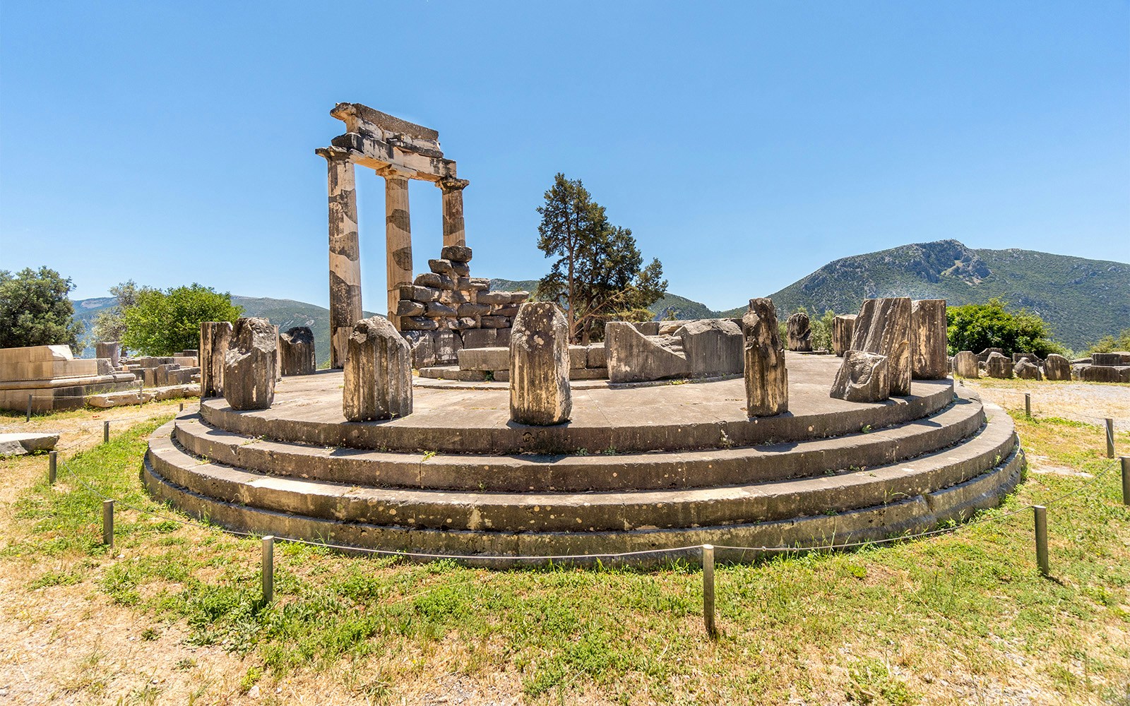 Ancient ruins of the Tholos at the Delphi archaeological site in Greece.