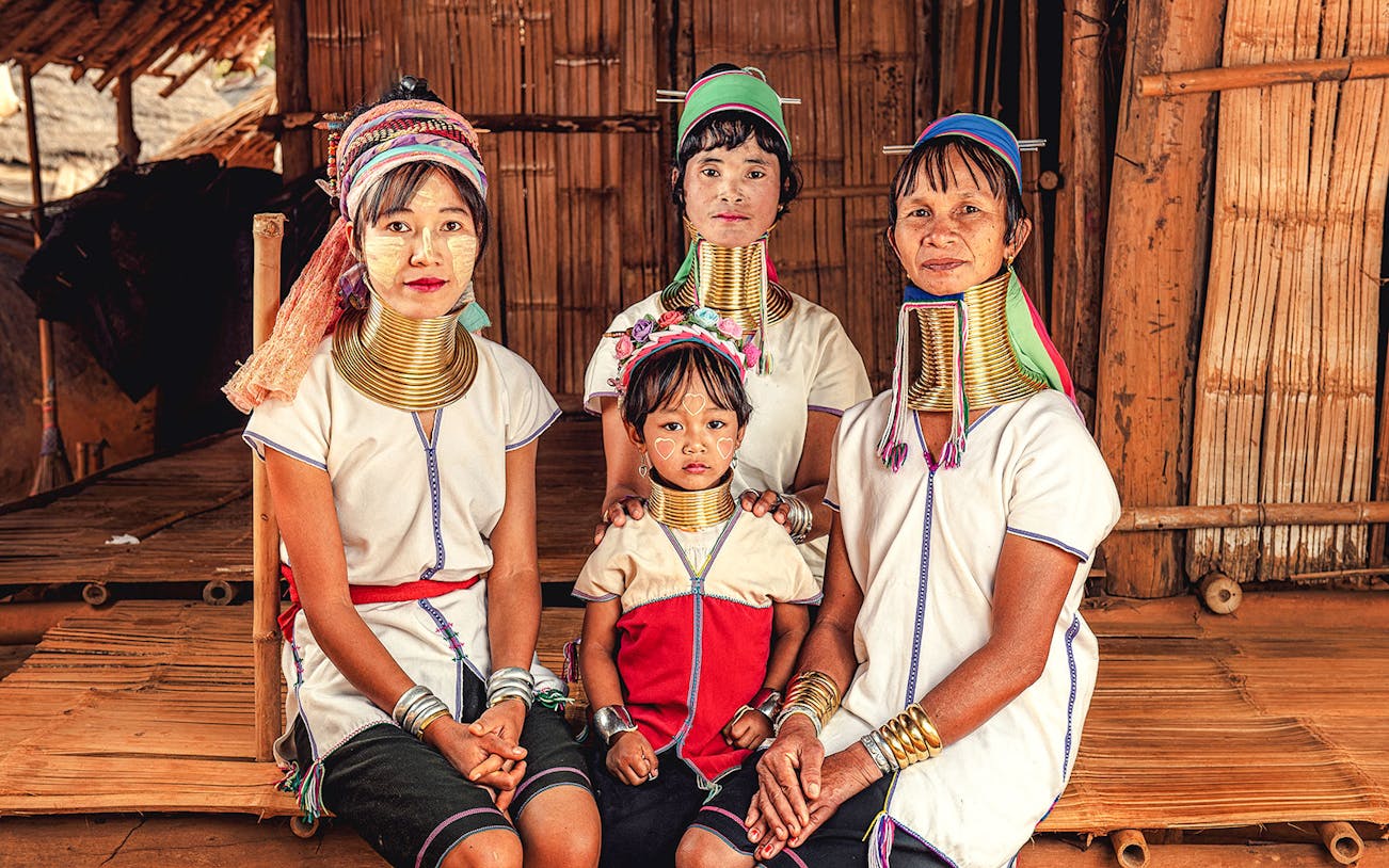 Karen Tribe women and child in traditional attire with neck rings at Sobhad village.