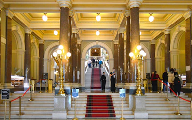 Grand staircase and ornate interior of the National Museum, Prague.