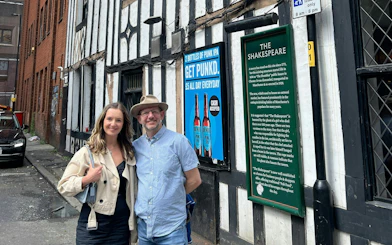 Visitors outside The Shakespeare pub in Manchester during a self-guided city exploration game.