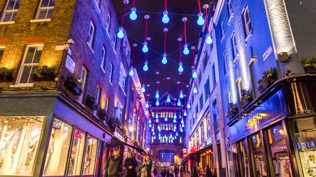 Soho street with blue lights during the Eating London: Twilight Soho Food & Drinks Tour.