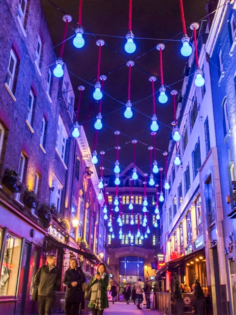 Soho street with blue lights during the Eating London: Twilight Soho Food & Drinks Tour.