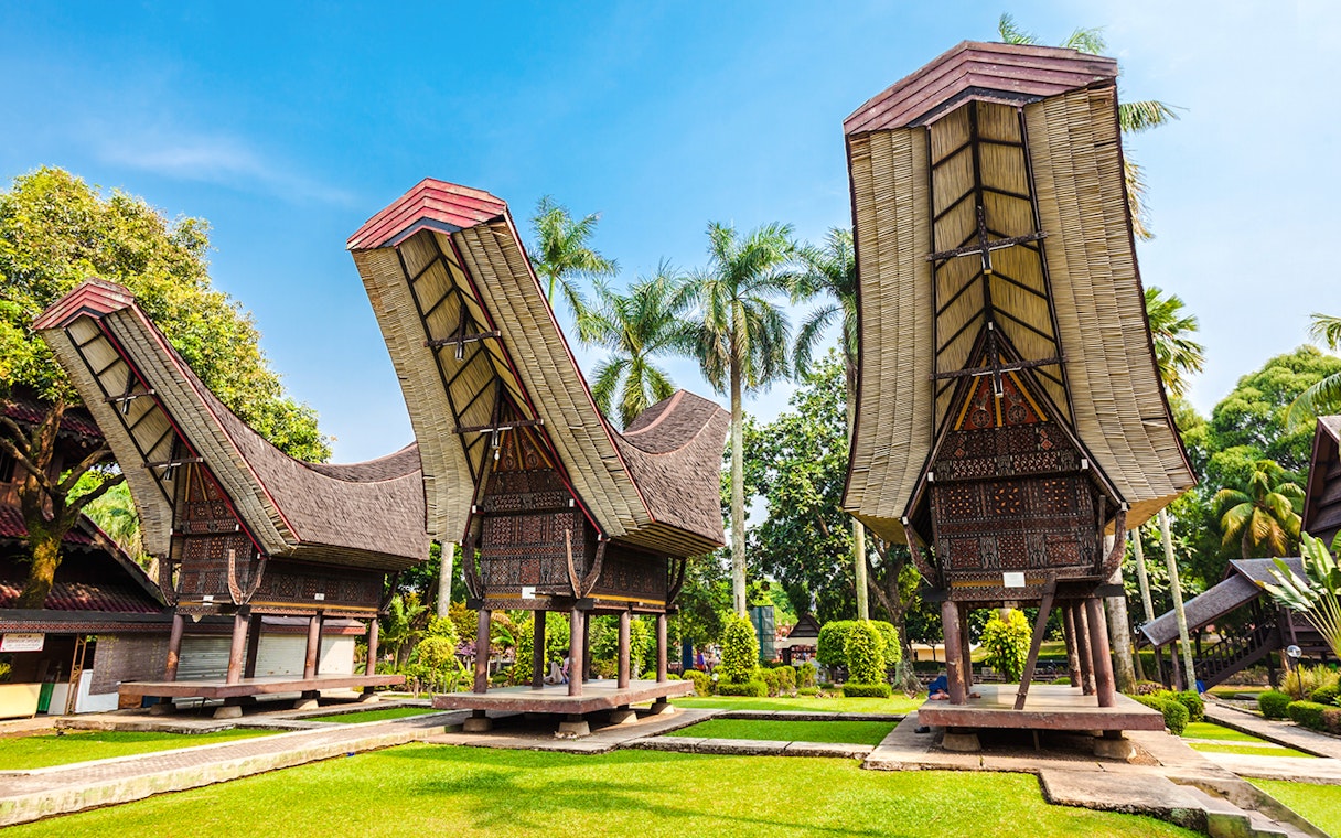 Traditional Indonesian houses with curved roofs at Taman Mini Indonesia.