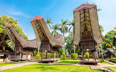 Traditional Indonesian houses with curved roofs at Taman Mini Indonesia.