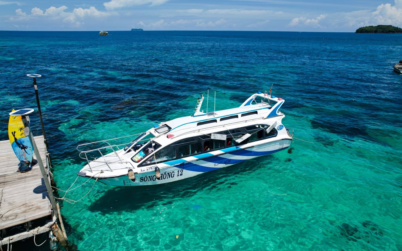 Speed boat anchored at Phu Quoc pier for 4 island day trip.