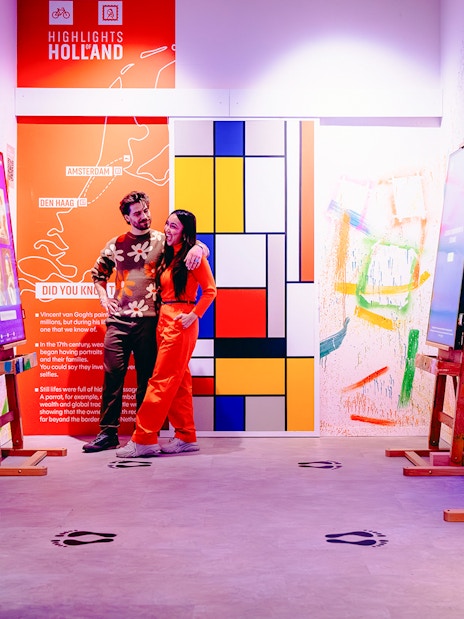 Guests enjoying interactive art displays at Highlights of Holland exhibit.