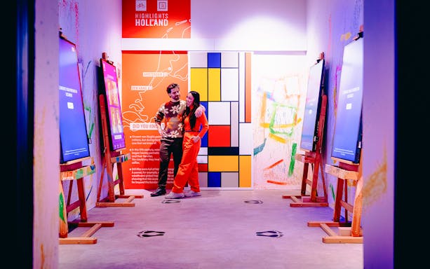 Guests enjoying interactive art displays at Highlights of Holland exhibit.