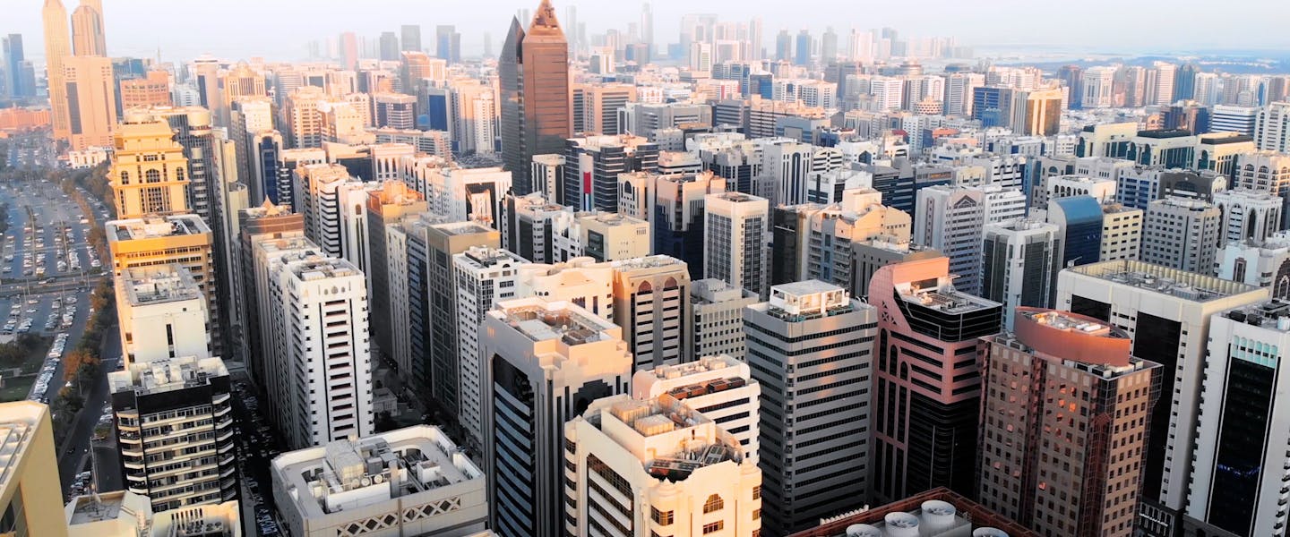 Gondola gliding through Venice canal with historic buildings in the background.