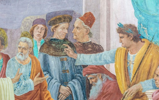 Fresco detail depicting a group of figures in discussion at Brancacci Chapel, Florence.