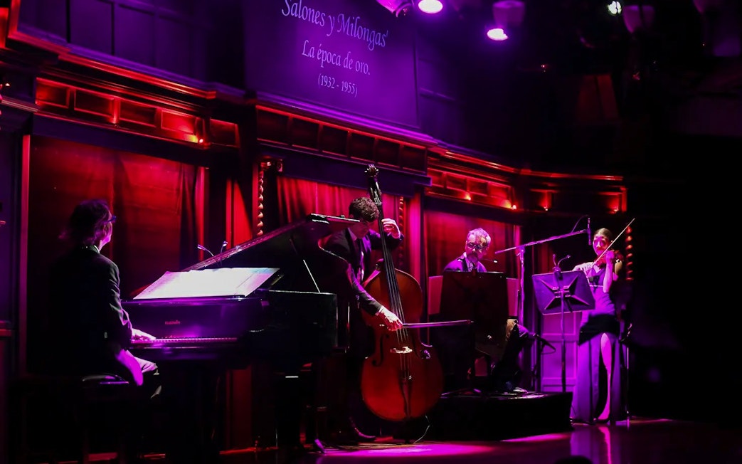 Musicians performing live at El Querandí Tango Show in Buenos Aires.