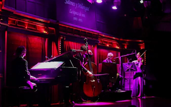 Musicians performing live at El Querandí Tango Show in Buenos Aires.