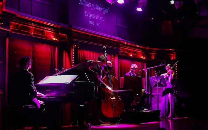 Musicians performing live at El Querandí Tango Show in Buenos Aires.
