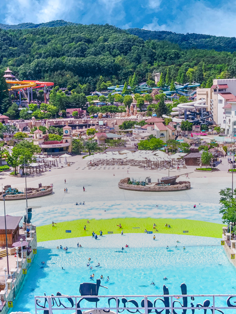 Caribbean Bay Water Park overview with pools, slides, and surrounding greenery.