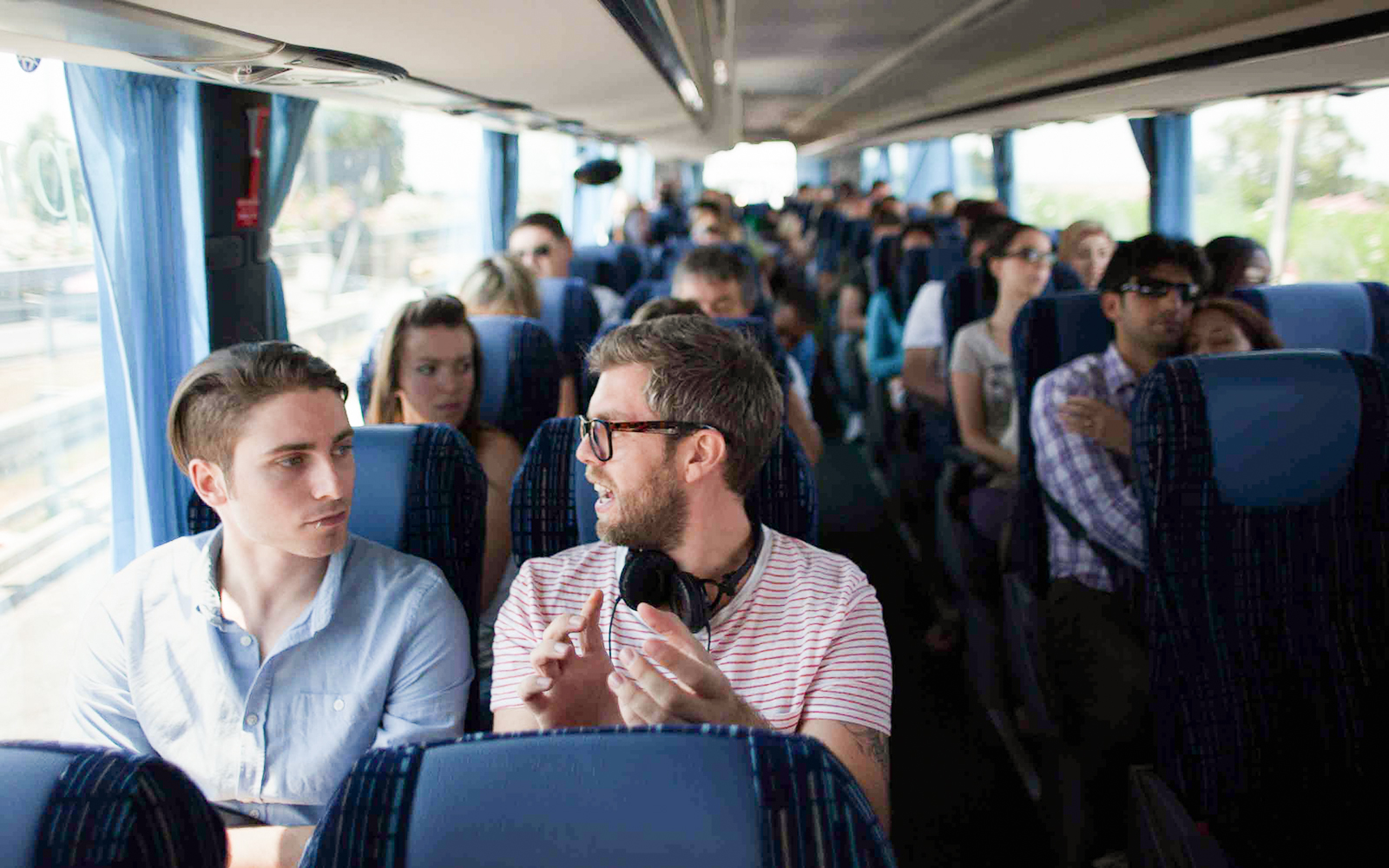 Tourists conversing inside a Terravision bus.