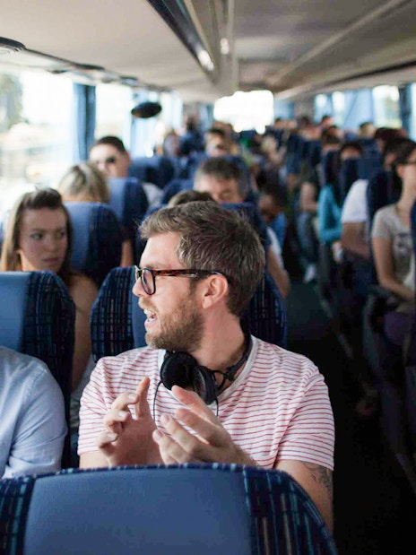 Tourists conversing inside a Terravision bus.