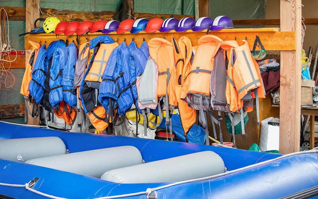 Life jackets and helmets for guided rafting in Tully River.