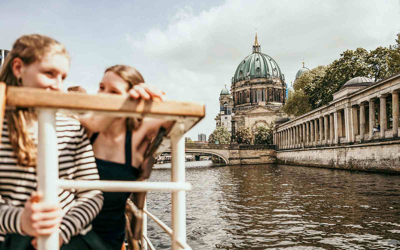 Berlin cityscape from cruise deck, featuring iconic landmarks and riverside views.