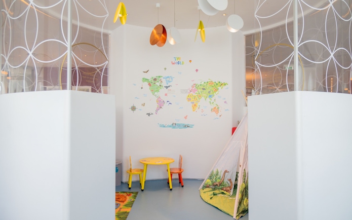 Kids play area with map wall and play tent, Plaza Express, Plaza Premium Lounge, London Gatwick Airport.