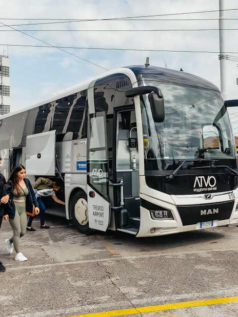 Bus at Venice Marco Polo Airport with passengers boarding for Piazzale Roma.