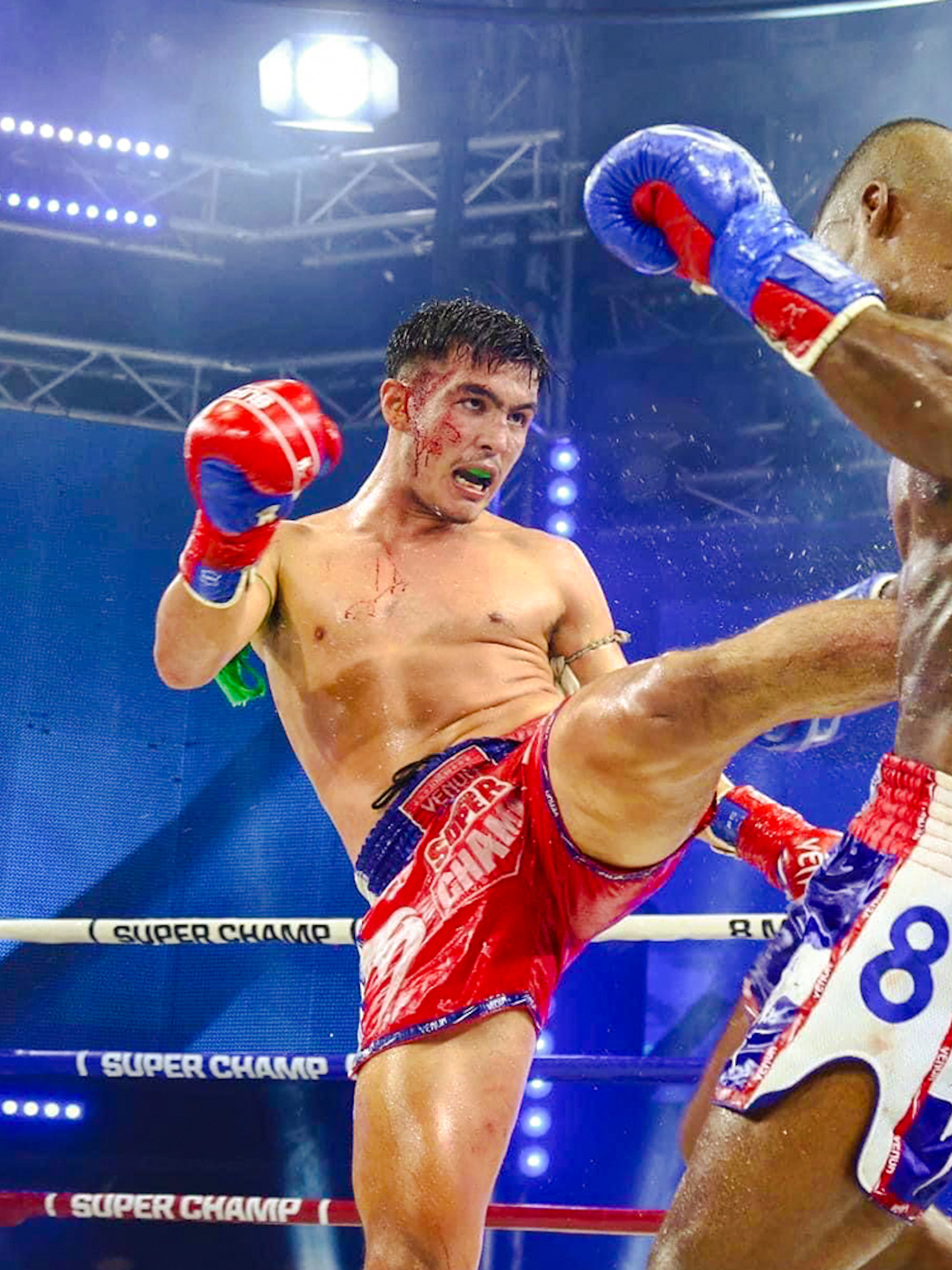 Muay Thai fighters in action at Patong Boxing Stadium, Phuket.