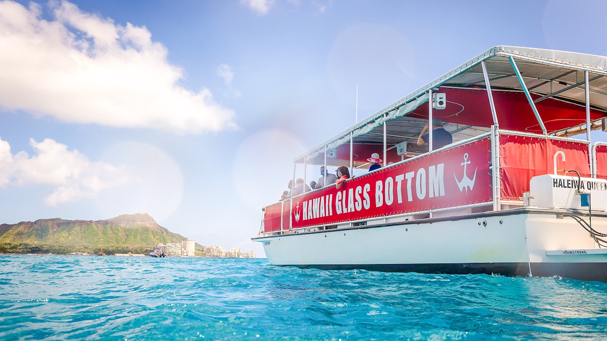 Hawaii glass-bottom boat tour near Waikiki with Diamond Head in the background.