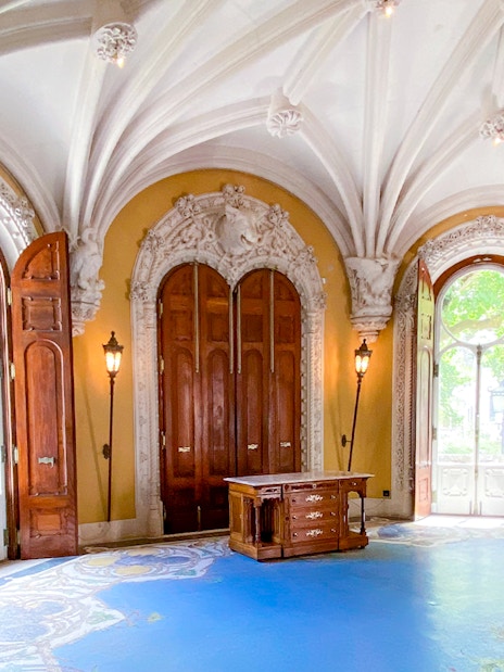 Quinta da Regaleira ornate room with arched ceiling and wooden doors in Sintra, Portugal.