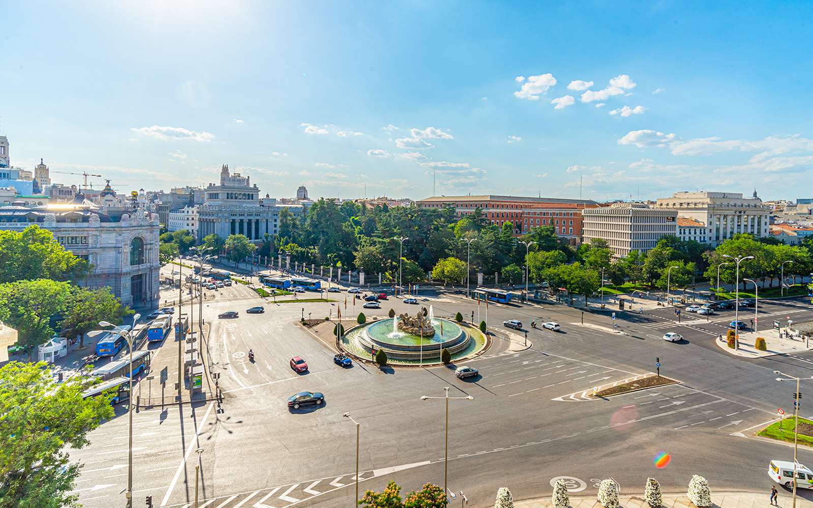 Cibeles fountain and Madrid traffic viewed from City Hall, with Paseo del Prado in the background.
