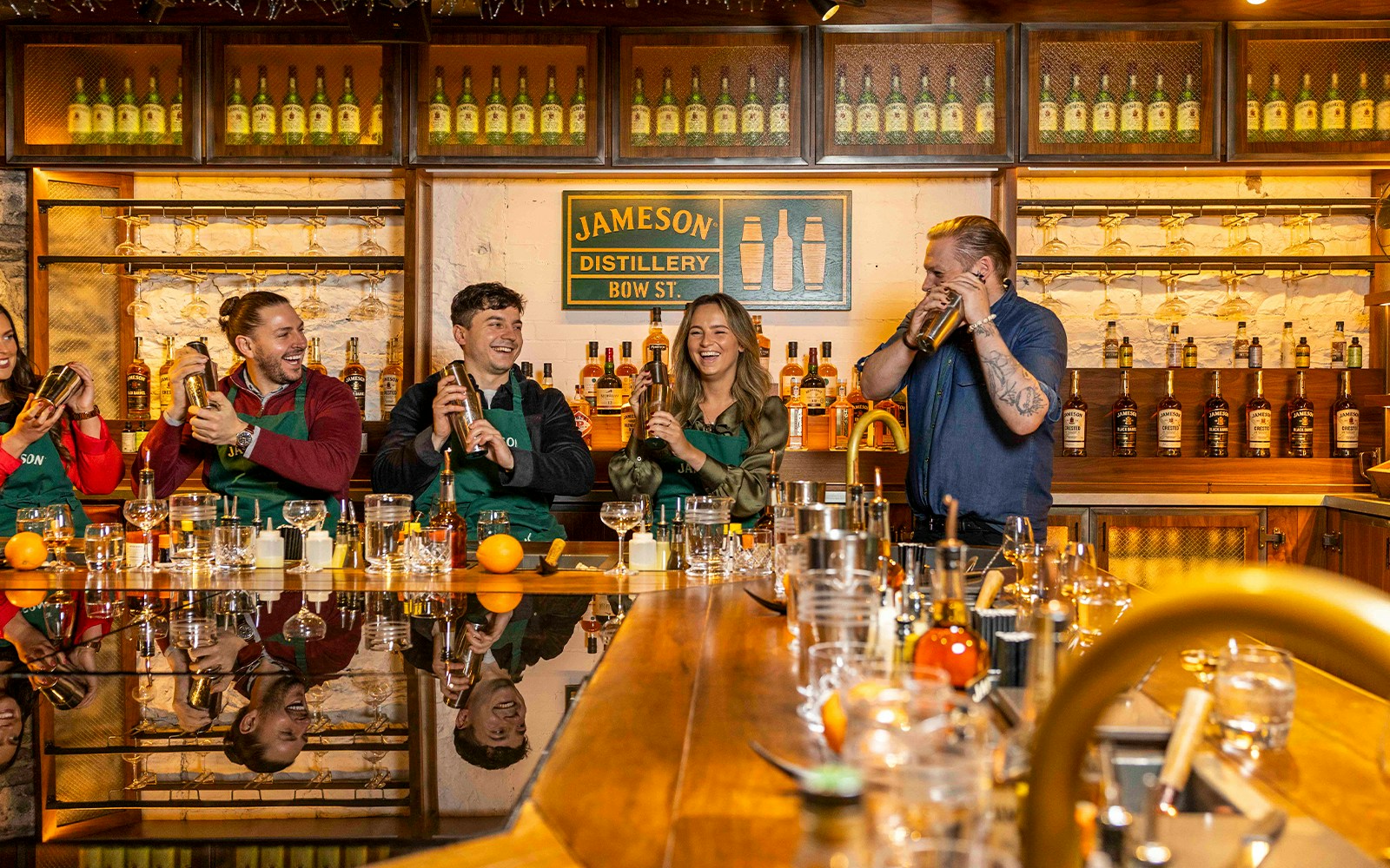 Jameson Distillery cocktail-making class with whiskey bottles and mixing tools in Dublin, Ireland.