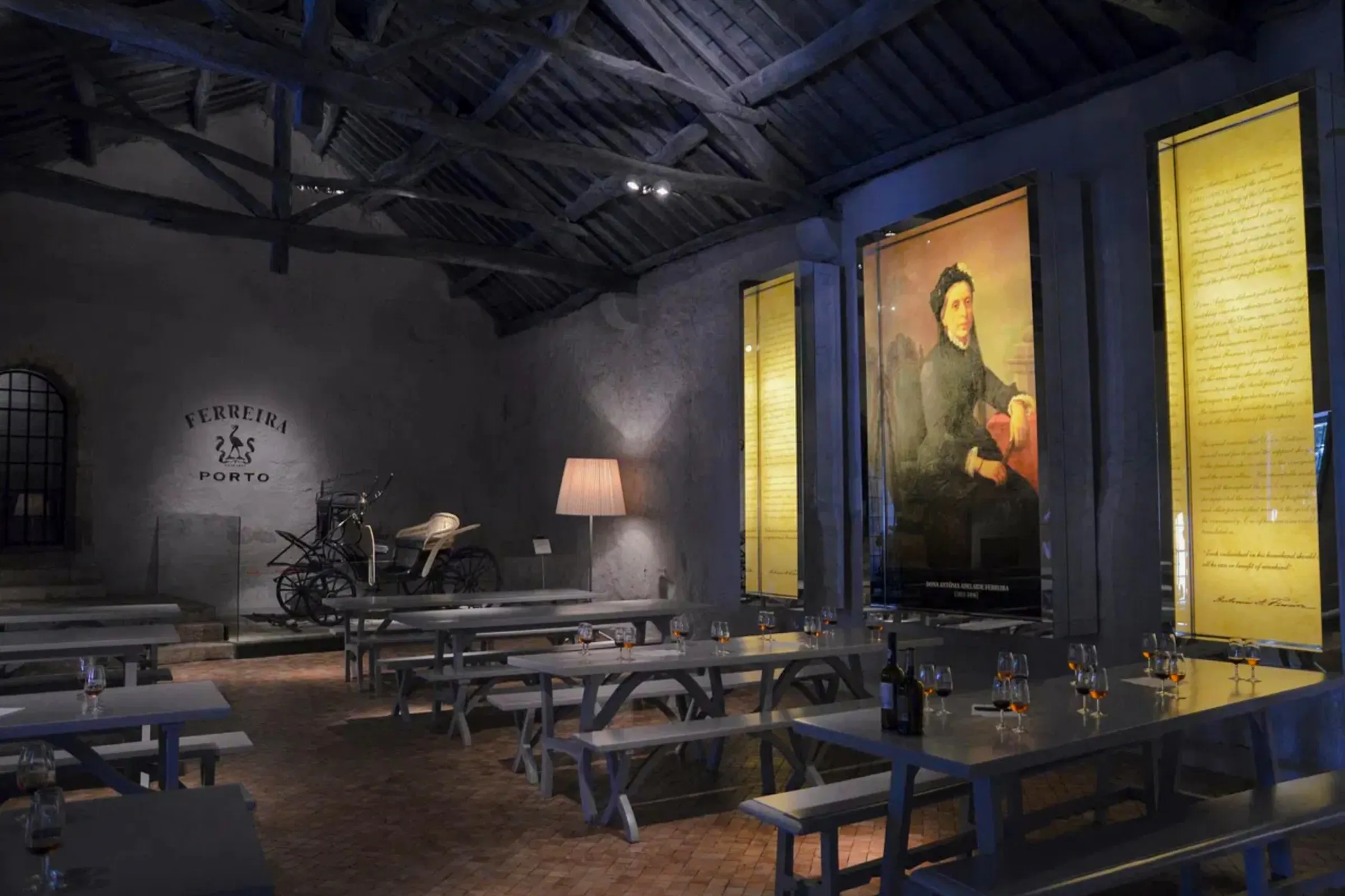 Ferreira Port Wine Cellar interior with tasting tables and historical displays, Porto.