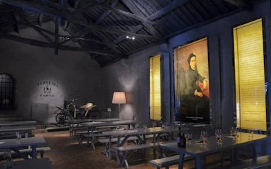Ferreira Port Wine Cellar interior with tasting tables and historical displays, Porto.