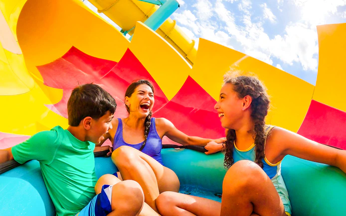 Group enjoying a water slide at Adventure Island, Tampa.